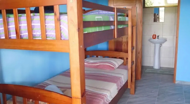 Кровать в общем номере Hostal Casa Las Lajas