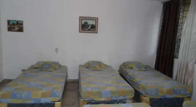 Кровать в общем номере Hostal Cumbres de El Salvador