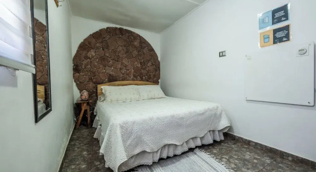 Кровать в общем номере Hostal Sumaj