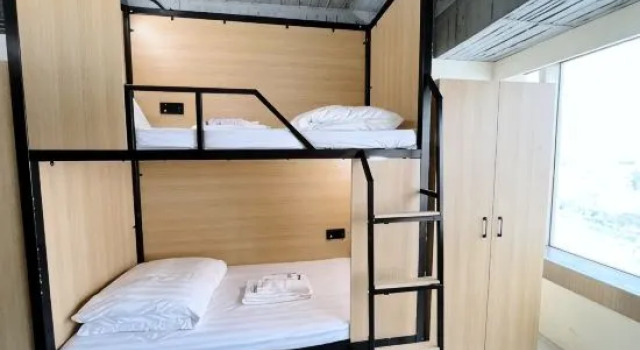 Кровать в общем номере Yoai Mountain Roam Hotel