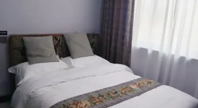 Четырёхместный люкс с 2 комнатами Homestay of Huatianyunyin
