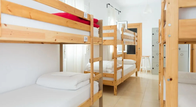 Кровать в общем номере La Casa Morada