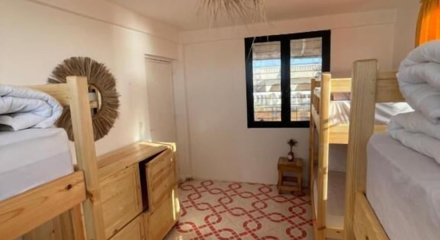Кровать в общем номере рядом с пляжем Epicswellhouse