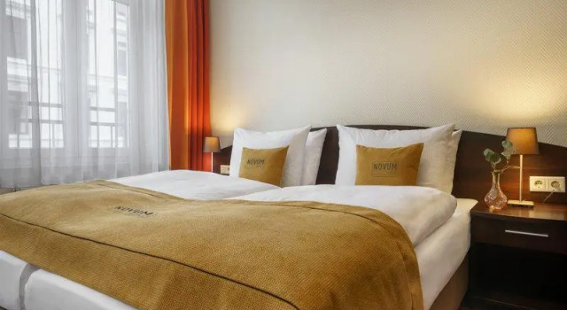 Кровать в общем номере Hotel Eleazar Novum City Center