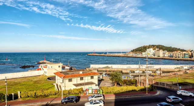 Кровать в общем номере Odri Inn Jeju