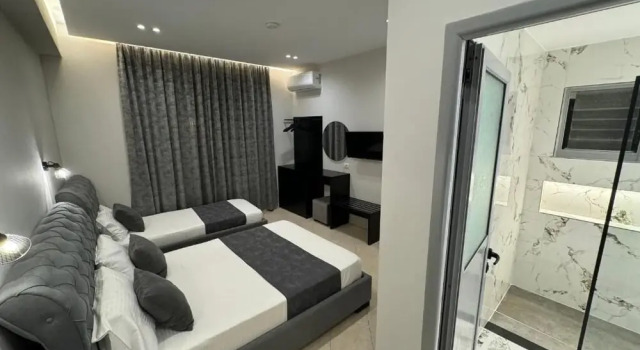 Supérieure triple chambre avec balcon et Avec vue Villa CACA