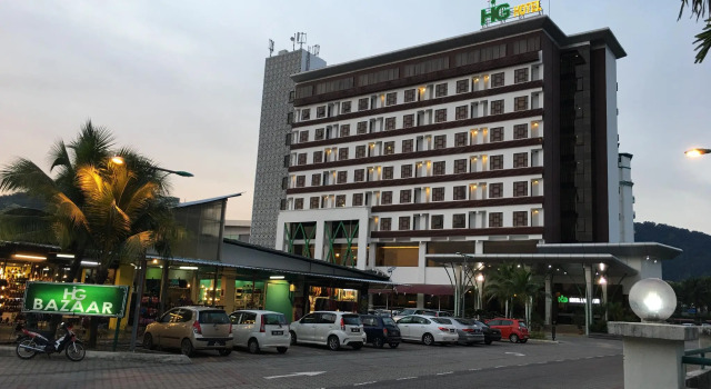 Кровать в общем номере HIG Hotel & Convention