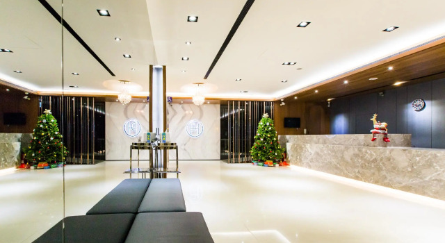 Łóżko w pokoju wieloosobowym VIP Hotel Taichung