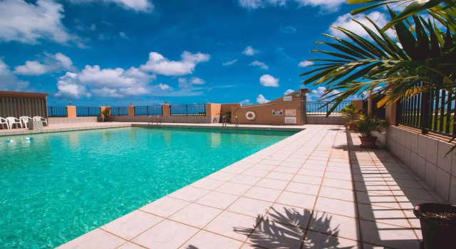 Кровать в общем номере SureStay by Best Western Guam Airport