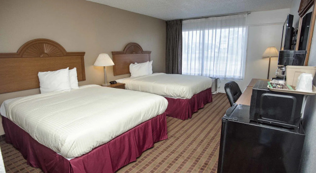 Express Inn & Suites, Забронировать Отель Гринвилл Dallas - Fort Worth Metropolitan Area, рядом с Муниципальное поле для гольфа McQuinney Howell в парке Райт