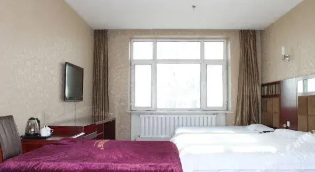 Кровать в общем номере Ruilong Hotel