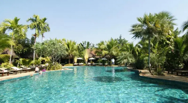 Кровать в общем номере Laluna Hotel And Resort, Chiang Rai