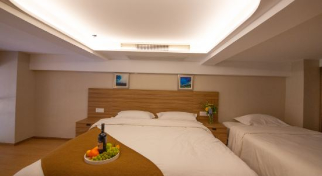 Кровать в общем номере Yinghong Apartment Hotel (Shanghai Jinqiao international store)