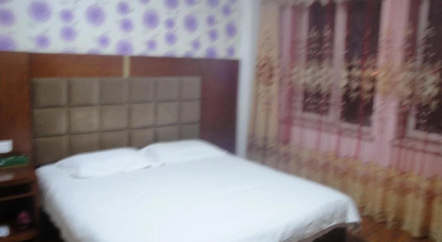Mudanjiang Wan Zai Business Hotel, Prenota Hotel Mudanjiang Heilongjiang