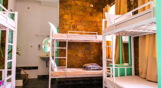 Кровать в общем номере The Turquoiise House