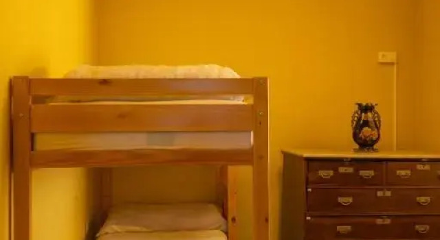 Кровать в общем номере Casa Jurado