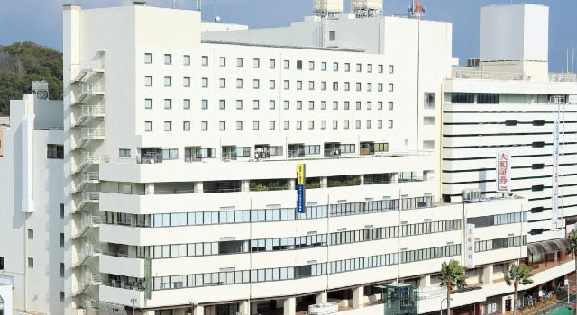 Кровать в общем номере Smile Hotel Tokushima