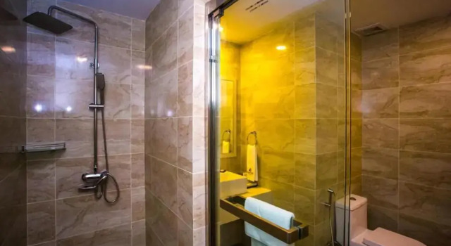 Кровать в общем номере Austin Park Hotel