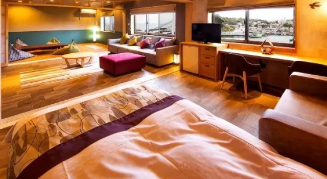 Кровать в общем номере Isaribinoyado Seaside Kancho