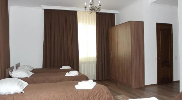 Кровать в общем номере Sweet House Guest house