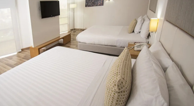 Четырёхместный номер Deluxe Hotel Cosmos Cali