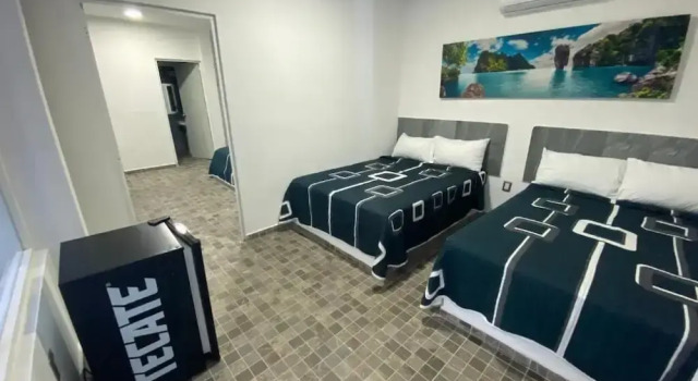 Кровать в общем номере Blue Inn Hotel & Suites