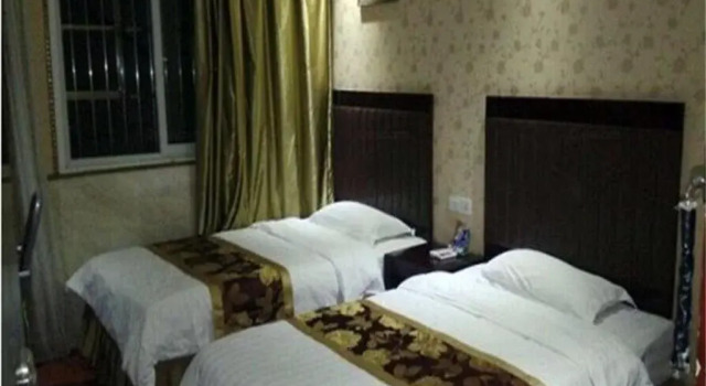 Yixin Business Hotel, Prenota Hotel Guanghan Sichuan