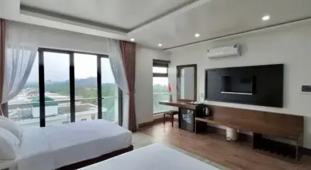 Кровать в общем номере Sen Biển Hotel Luxury Sầm Sơn