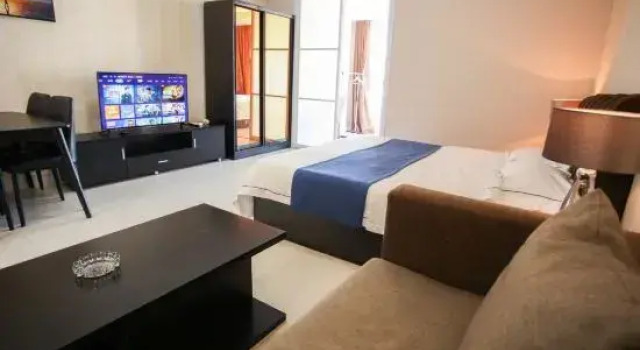 Четырёхместный семейный люкс с видом на море Dalian Xinghai Micro Lan Xiaozhu Apartment