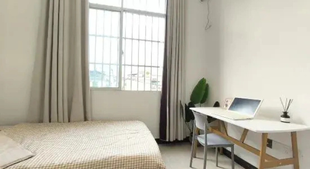 Кровать в общем номере Mangshi Youwang Hostel