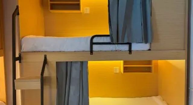 Кровать в общем номере Phoenix.PG Diving Resort