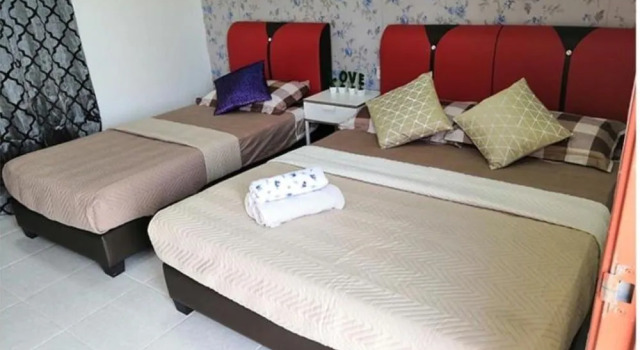 OYO Home 90389 Haji Hassan Guesthouse, Boek Hotel Pantai Cenang 