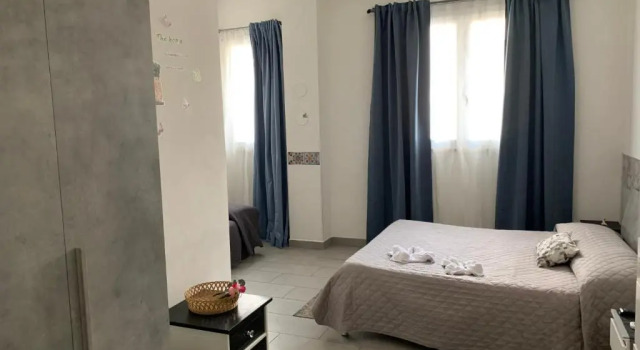 Кровать в общем номере Raggio di Sole