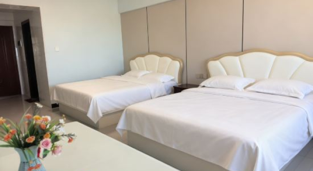 Кровать в общем номере Manzhouli Yunbian Sightseeing Hotel Apartment (Huadu Building High-rise Branch)