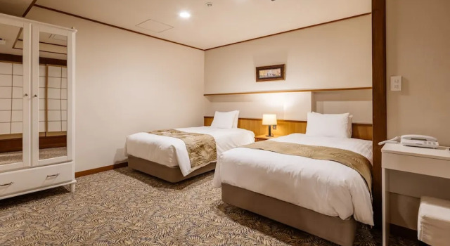 Кровать в общем номере с частичным видом на море Infinito Hotel and Spa