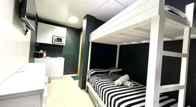 Vuode makuusalissa Super OYO 910 Sabaidee Suites