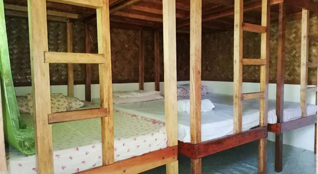 Кровать в общем номере Liminangcong Beach Resort