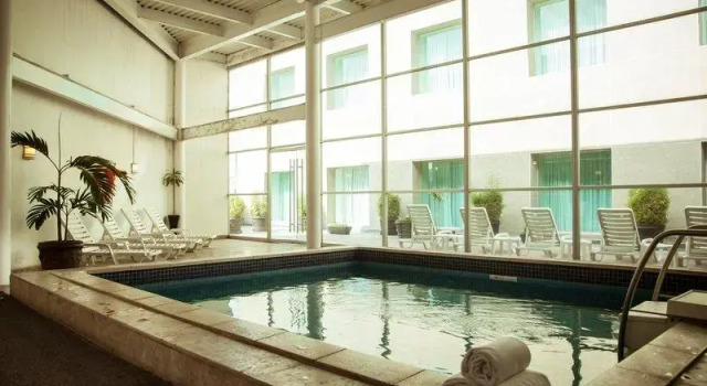 Кровать в общем номере Fiesta Inn Periferico Sur