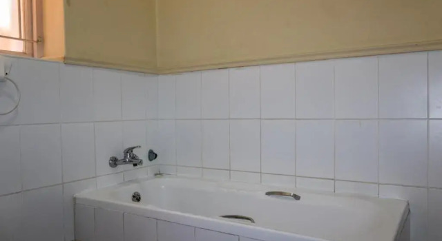 Кровать в общем номере Bay Vista Guesthouse
