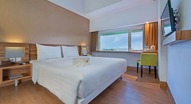 Кровать в общем номере Whiz Prime Hotel Balikpapan