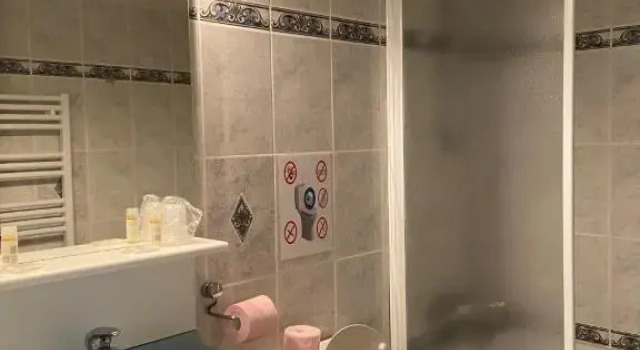 Кровать в общем номере Golf Hotel De La Carte