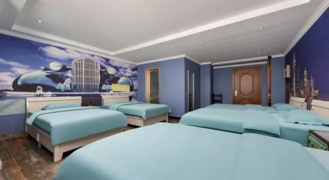 Кровать в общем номере Zhoukou Qiyatu Fashion Hotel