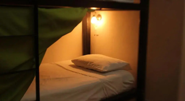 Vuode makuusalissa Hostal Real San Juan
