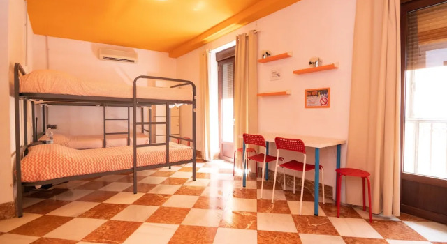 Кровать в общем номере Arce apartamentos