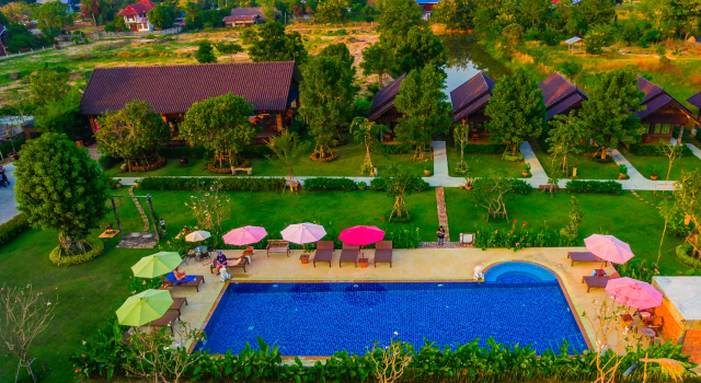 Кровать в общем номере Sawasdee Sukhothai Resort