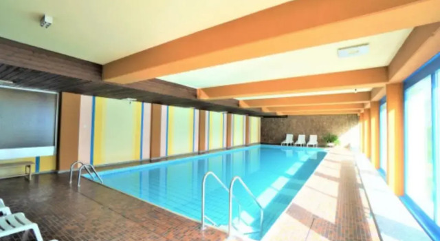 Апартаменты Lovely 1-bedroom vacation studio apartment with pool and sauna