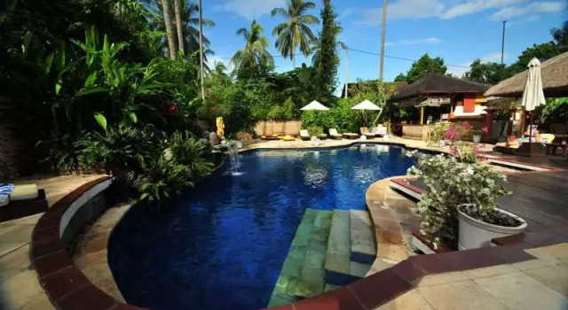 Кровать в общем номере The Water Garden Hotel
