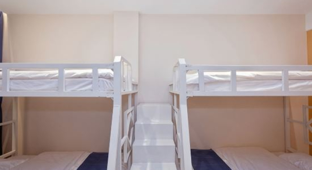 Кровать в общем номере Fujia Business Hotel
