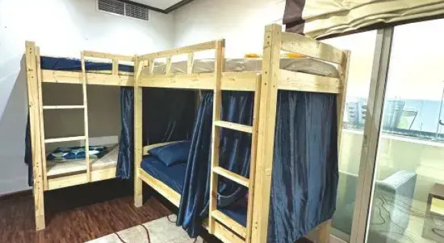 Кровать в общем номере Homeland Hostel