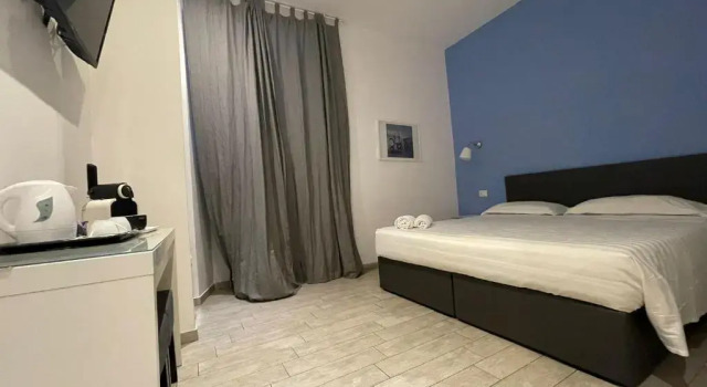 Трёхместный номер Economy Relais Merulana Guest House